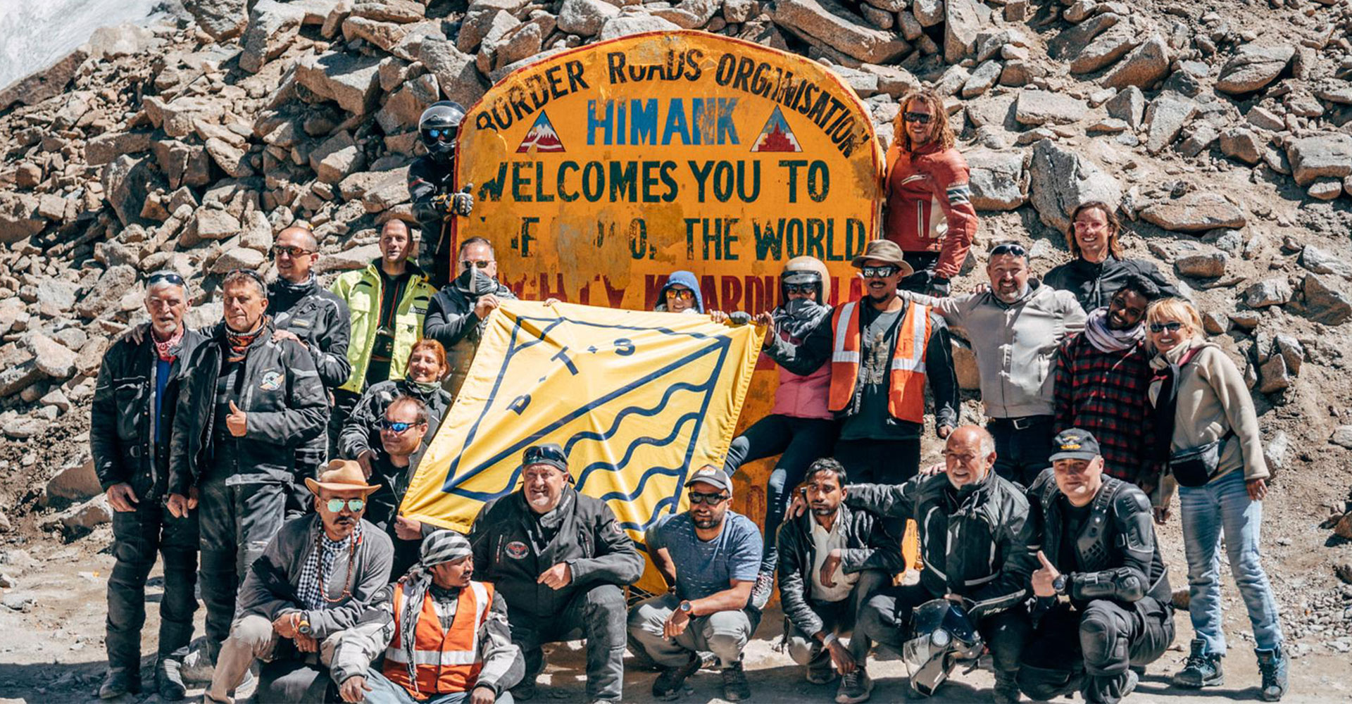 Happy BTS team on the summit of the world's highest motorable pass, the mighty Khardung La 5,359 meters above sea level.