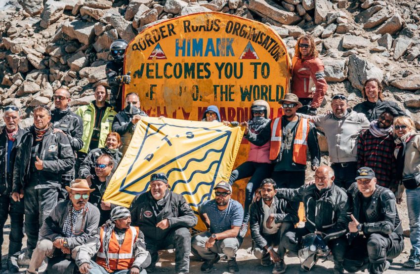 Happy BTS team on the summit of the world's highest motorable pass, the mighty Khardung La 5,359 meters above sea level.